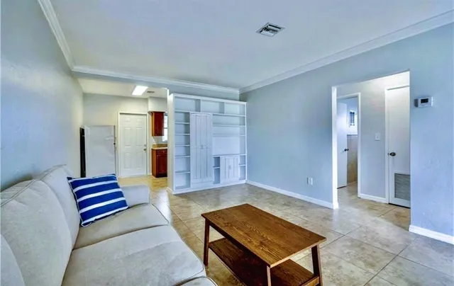 a living room with furniture and a rug