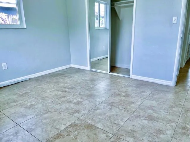 an empty room with entrance and door