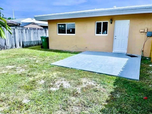 a view of a backyard of the house