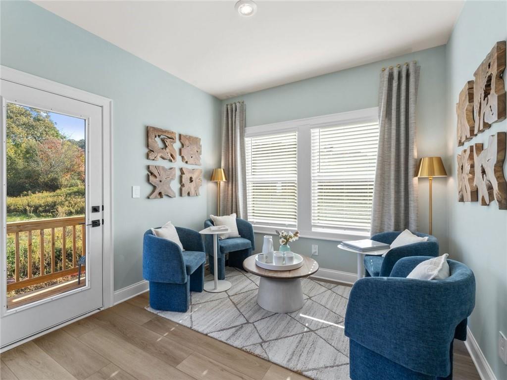 6410 Pinin Place Cumming, GA 30041 - Photo 6 of 11 a living room with furniture a window and a table