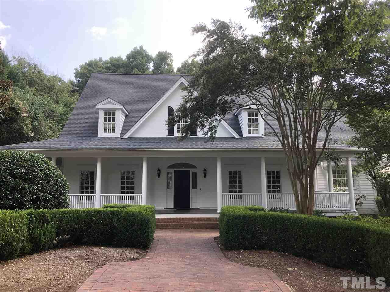 front view of a house with a garden