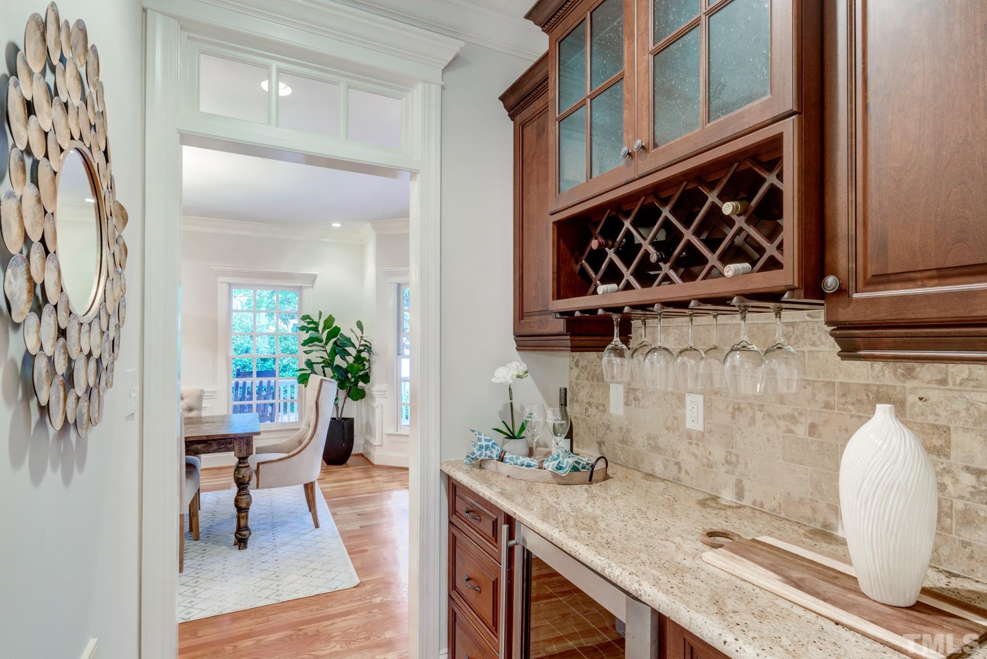 109 Ronsard Lane Cary, NC 27511 - Photo 12 of 26 a dining room with wooden floor and potted plant