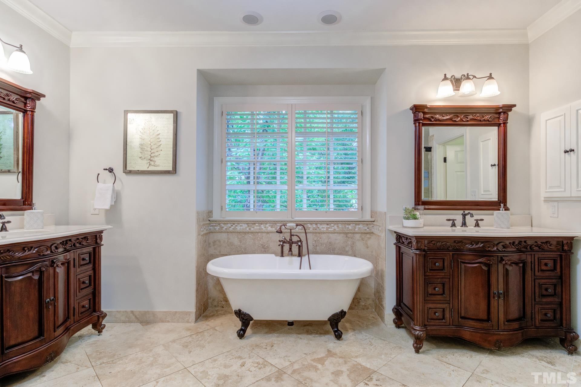 109 Ronsard Lane Cary, NC 27511 - Photo 15 of 26 a spacious bathroom with a tub sink and mirror