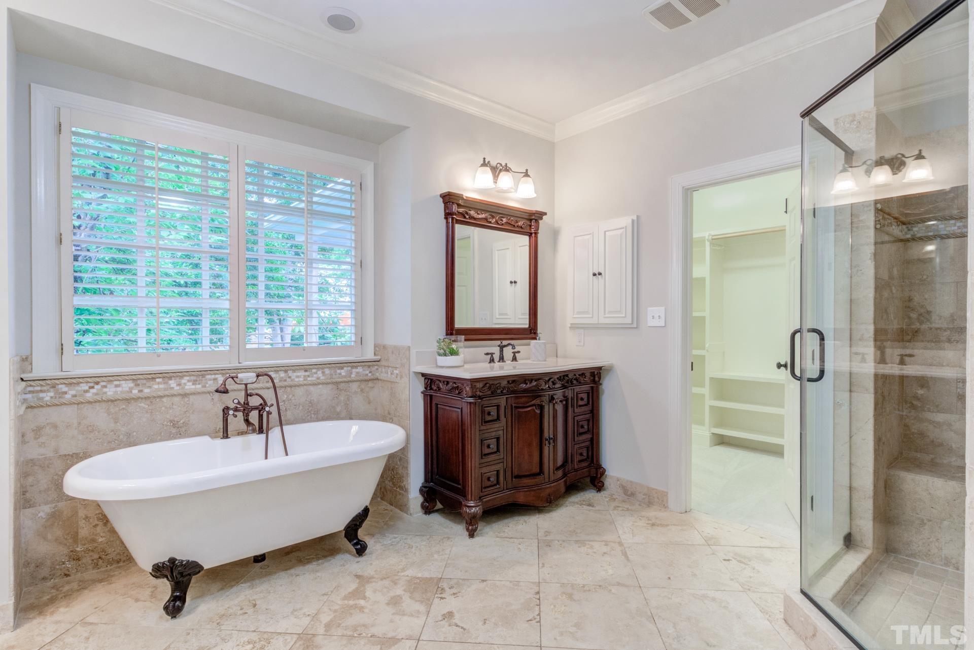 109 Ronsard Lane Cary, NC 27511 - Photo 16 of 26 a spacious bathroom with a tub sink and mirror