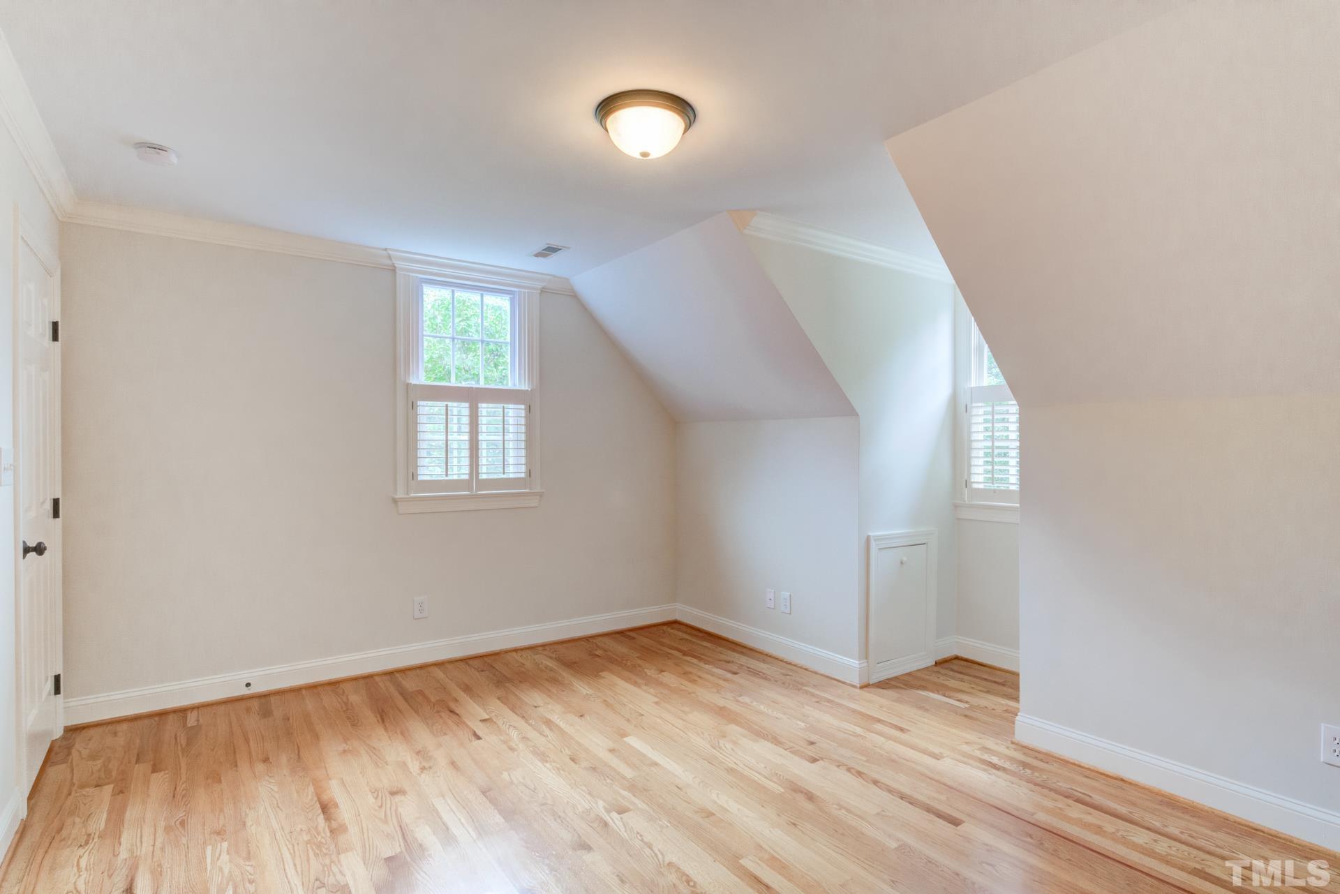 109 Ronsard Lane Cary, NC 27511 - Photo 20 of 26 an empty room with wooden floor and windows