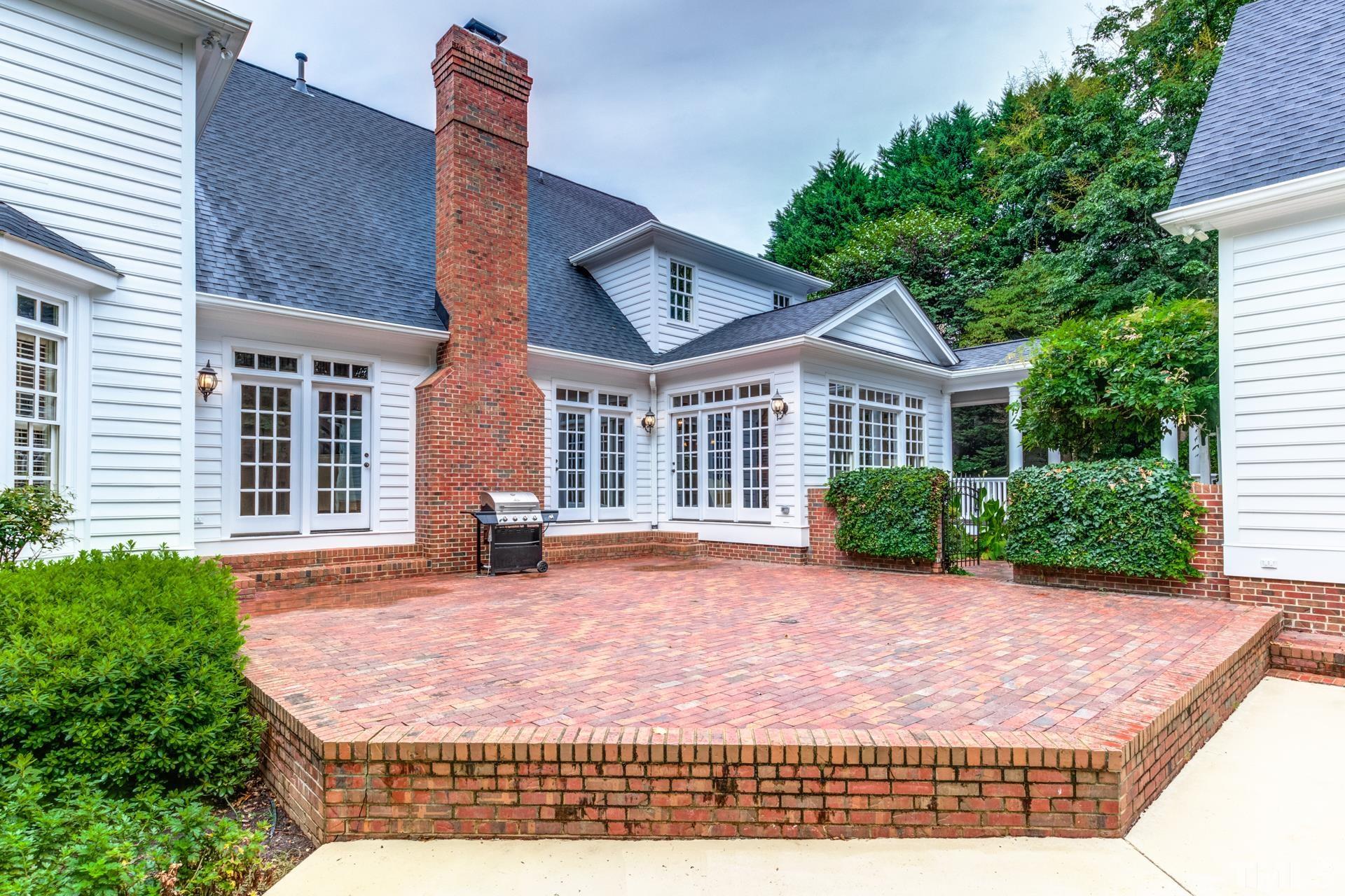 109 Ronsard Lane Cary, NC 27511 - Photo 25 of 26 a front view of a house with a garden