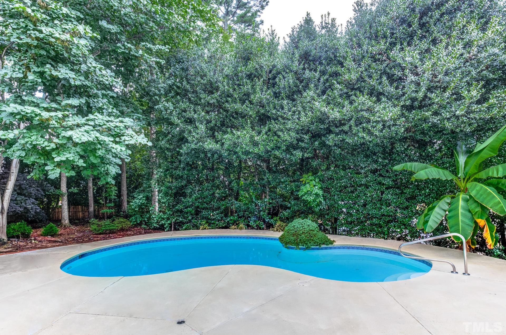 109 Ronsard Lane Cary, NC 27511 - Photo 26 of 26 a view of a swimming pool and trees in the background