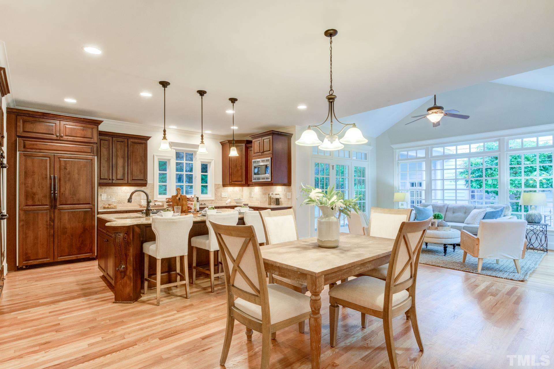 109 Ronsard Lane Cary, NC 27511 - Photo 8 of 26 a large kitchen with a table and chairs