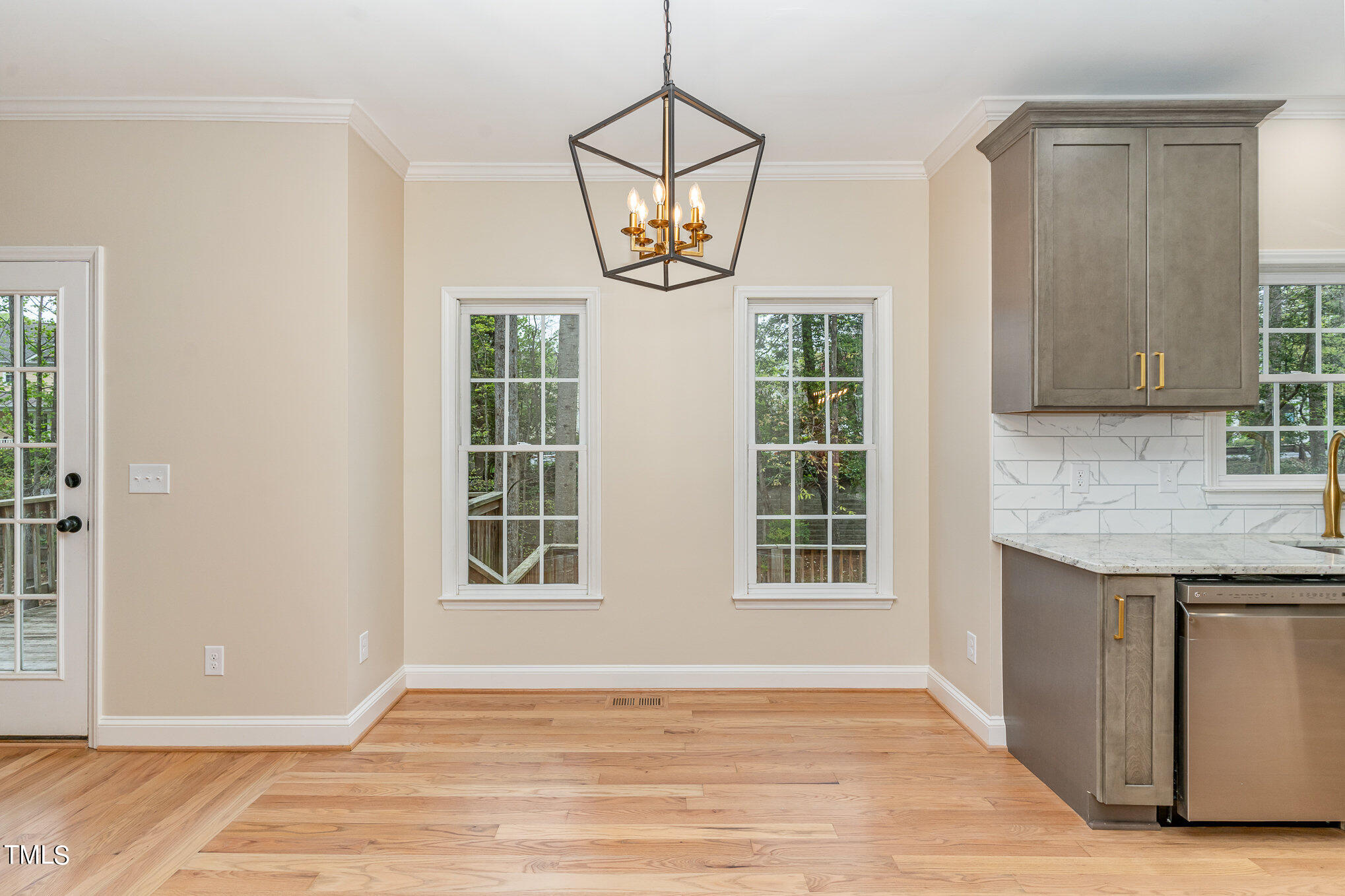 2204 Dunlin Lane Raleigh, NC 27614 - Photo 10 of 32 a view of an empty room with window and wooden floor
