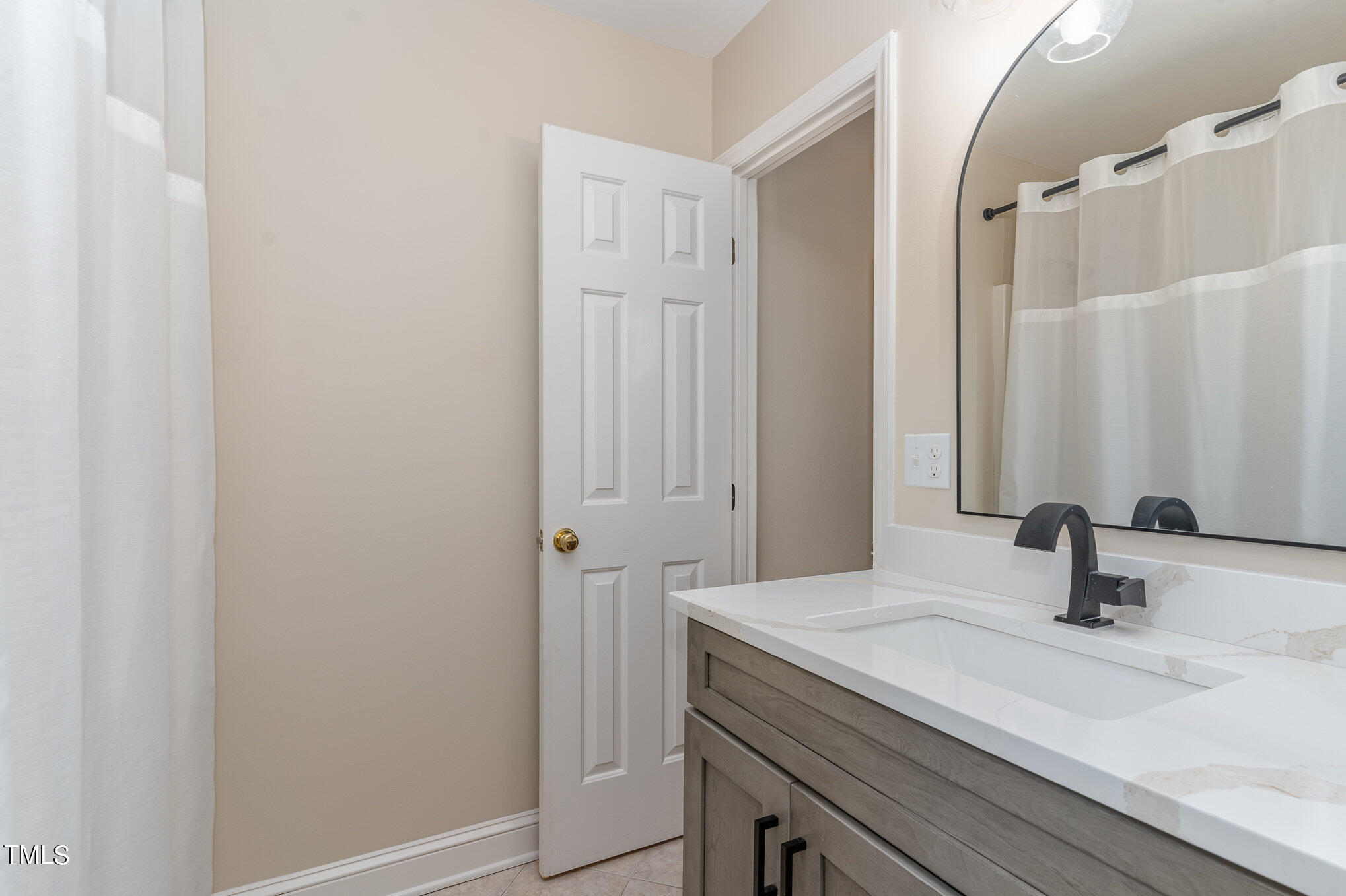 2204 Dunlin Lane Raleigh, NC 27614 - Photo 15 of 32 a bathroom with a sink and vanity
