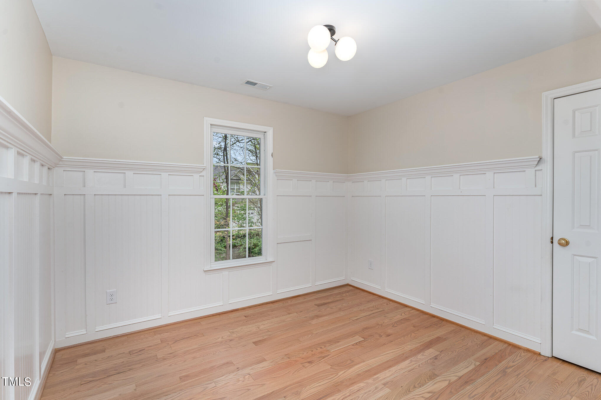 2204 Dunlin Lane Raleigh, NC 27614 - Photo 16 of 32 an empty room with wooden floor and windows