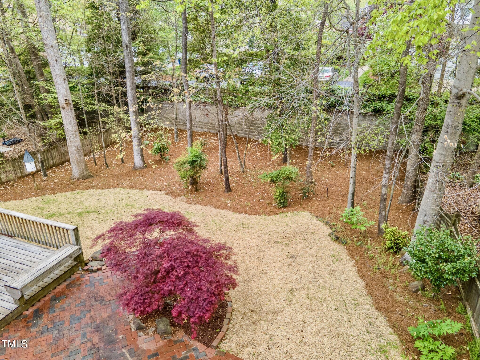 2204 Dunlin Lane Raleigh, NC 27614 - Photo 22 of 32 a patio with table and chairs and potted plants