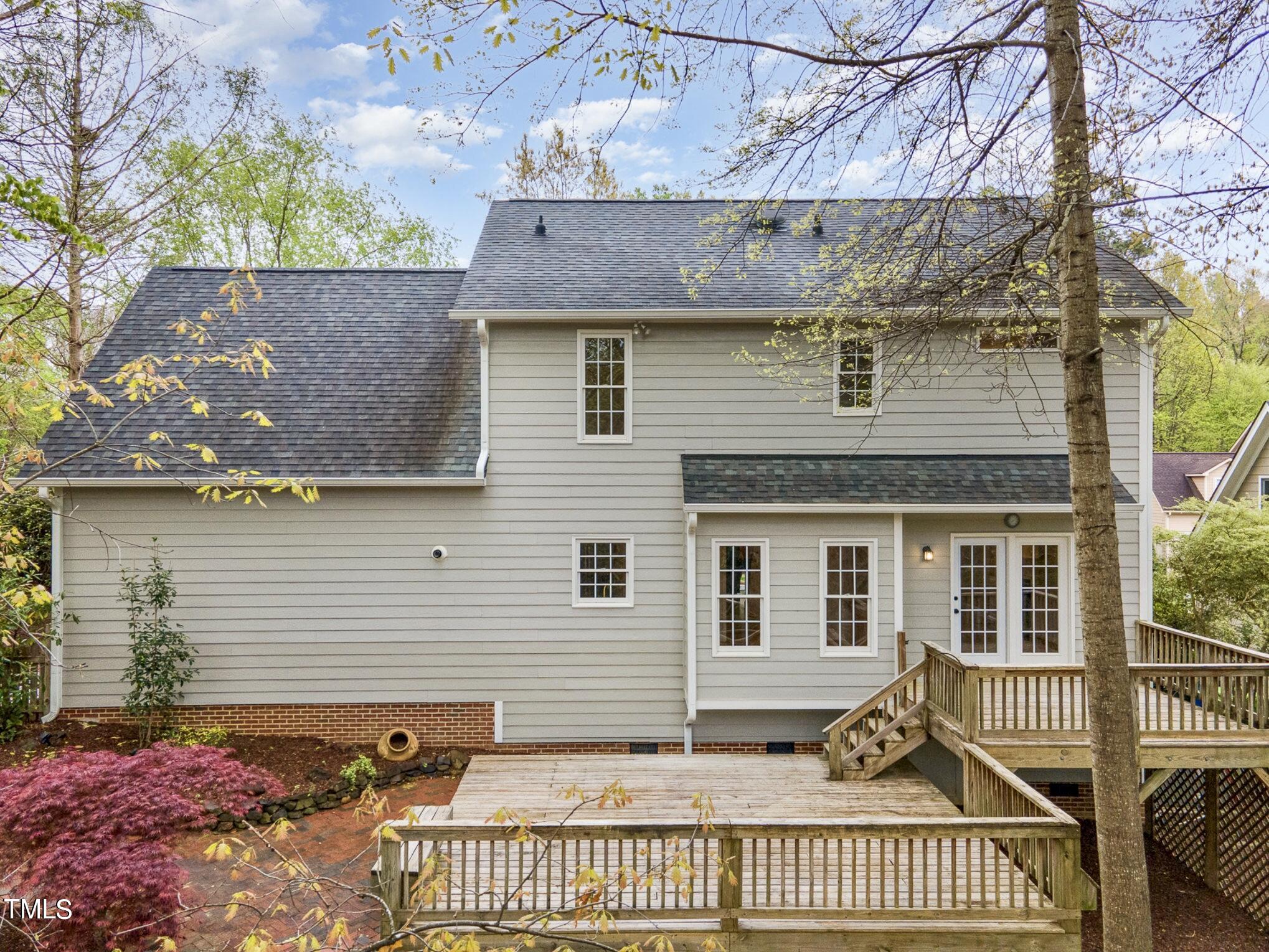 2204 Dunlin Lane Raleigh, NC 27614 - Photo 23 of 32 a view of a house with a small yard and wooden fence