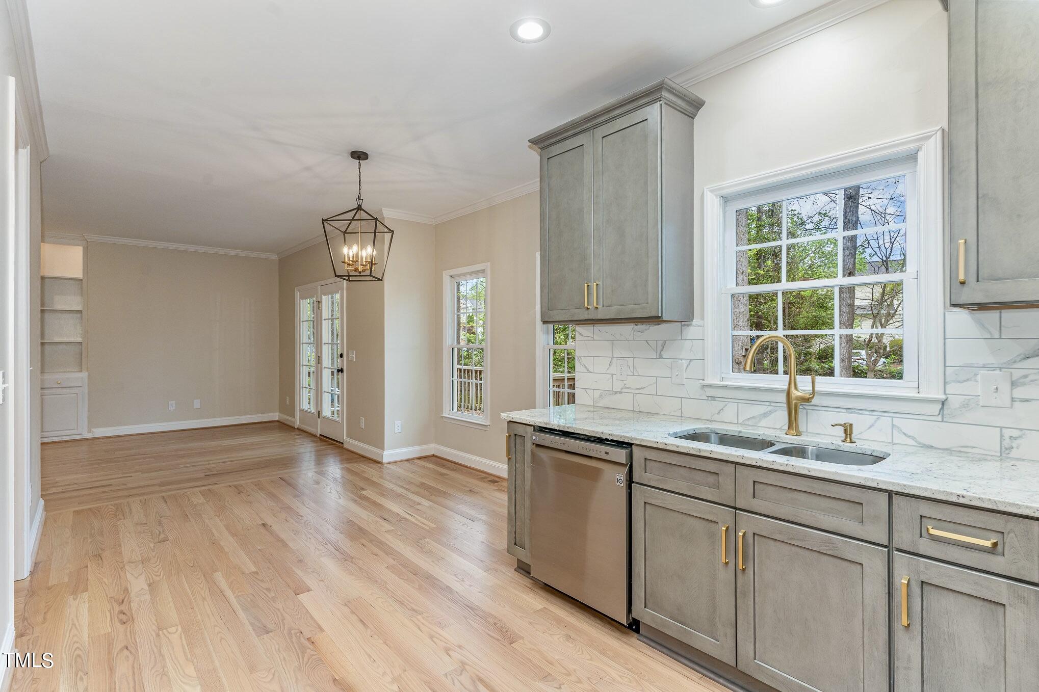2204 Dunlin Lane Raleigh, NC 27614 - Photo 9 of 32 a kitchen with a sink cabinets and window