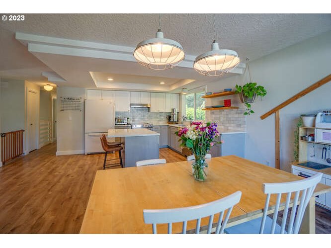 111 Northeast 19th Avenue Camas, WA 98607 - Photo 12 of 48 a view of a dining room with furniture and a chandelier