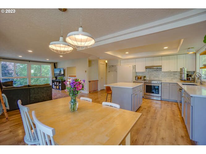 111 Northeast 19th Avenue Camas, WA 98607 - Photo 13 of 48 a living room with stainless steel appliances kitchen island a table and chairs