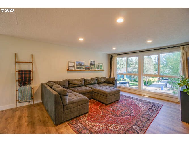 111 Northeast 19th Avenue Camas, WA 98607 - Photo 16 of 48 a living room with furniture and a floor to ceiling window