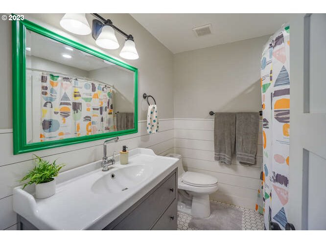 111 Northeast 19th Avenue Camas, WA 98607 - Photo 21 of 48 a bathroom with a sink mirror and toilet