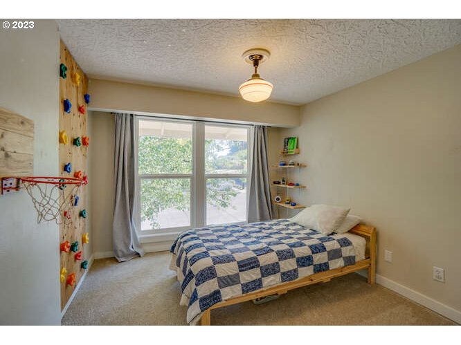 111 Northeast 19th Avenue Camas, WA 98607 - Photo 23 of 48 a bedroom with a bed and a window