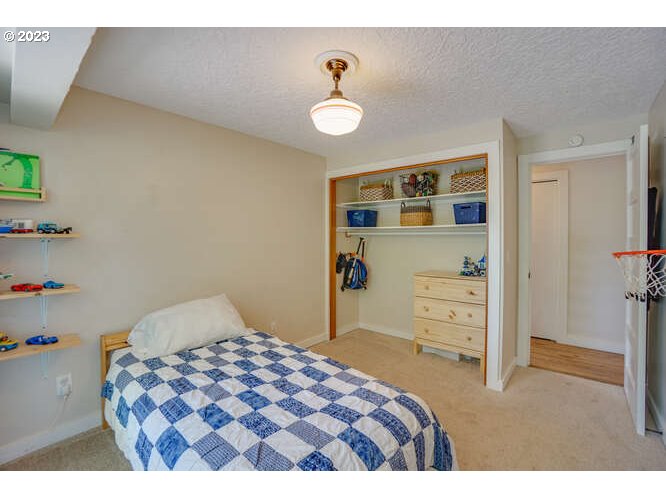 111 Northeast 19th Avenue Camas, WA 98607 - Photo 24 of 48 a bedroom with a bed and a cabinets