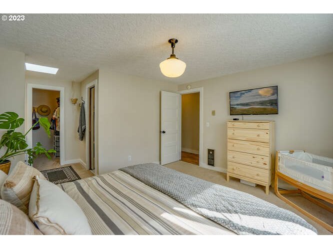 111 Northeast 19th Avenue Camas, WA 98607 - Photo 29 of 48 a bedroom with a bed and a ceiling fan