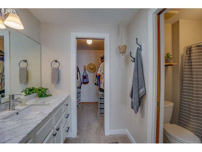 111 Northeast 19th Avenue Camas, WA 98607 - Photo 31 of 48 a bathroom with a granite countertop sink and a mirror