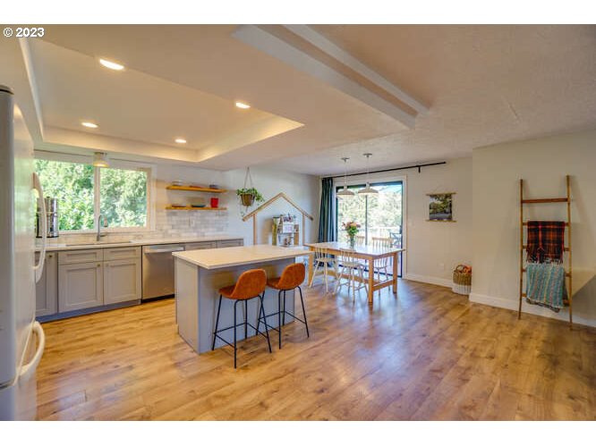 111 Northeast 19th Avenue Camas, WA 98607 - Photo 6 of 48 a kitchen with stainless steel appliances wooden floor dining table and chairs
