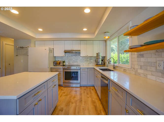 111 Northeast 19th Avenue Camas, WA 98607 - Photo 8 of 48 a kitchen with a sink stove and refrigerator