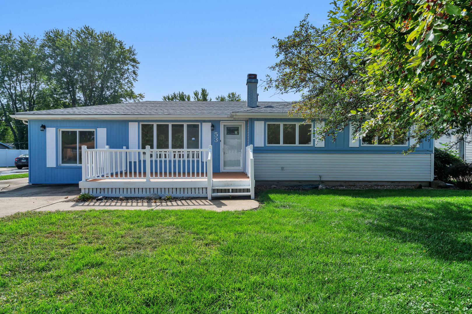 a view of a house with a yard and a garden