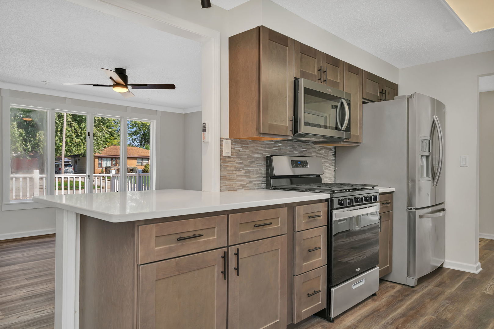 53 Duncan Drive Bourbonnais, IL 60914 - Photo 11 of 49 a kitchen with stainless steel appliances a stove a refrigerator and a sink