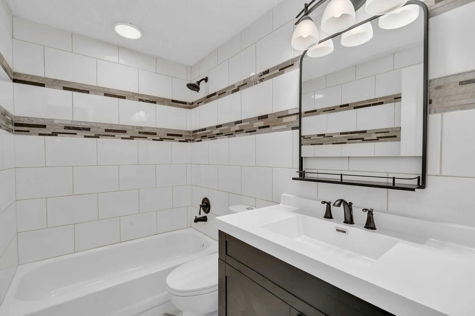 53 Duncan Drive Bourbonnais, IL 60914 - Photo 16 of 49 a bathroom with a sink a toilet and a bathtub