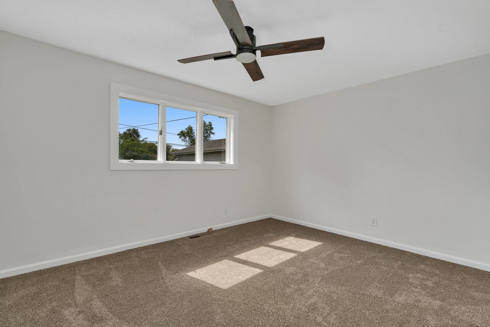 53 Duncan Drive Bourbonnais, IL 60914 - Photo 17 of 49 a view of a livingroom with a ceiling fan & windows