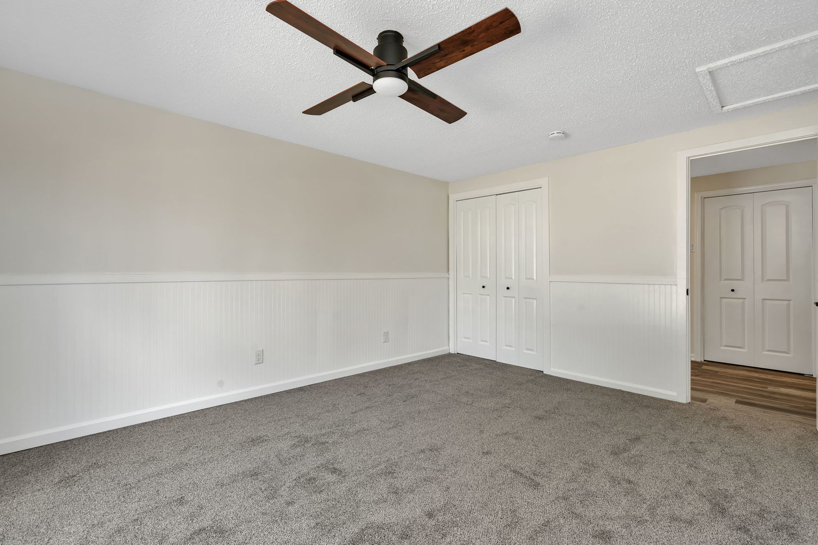 53 Duncan Drive Bourbonnais, IL 60914 - Photo 20 of 49 an empty room with a ceiling fan and window