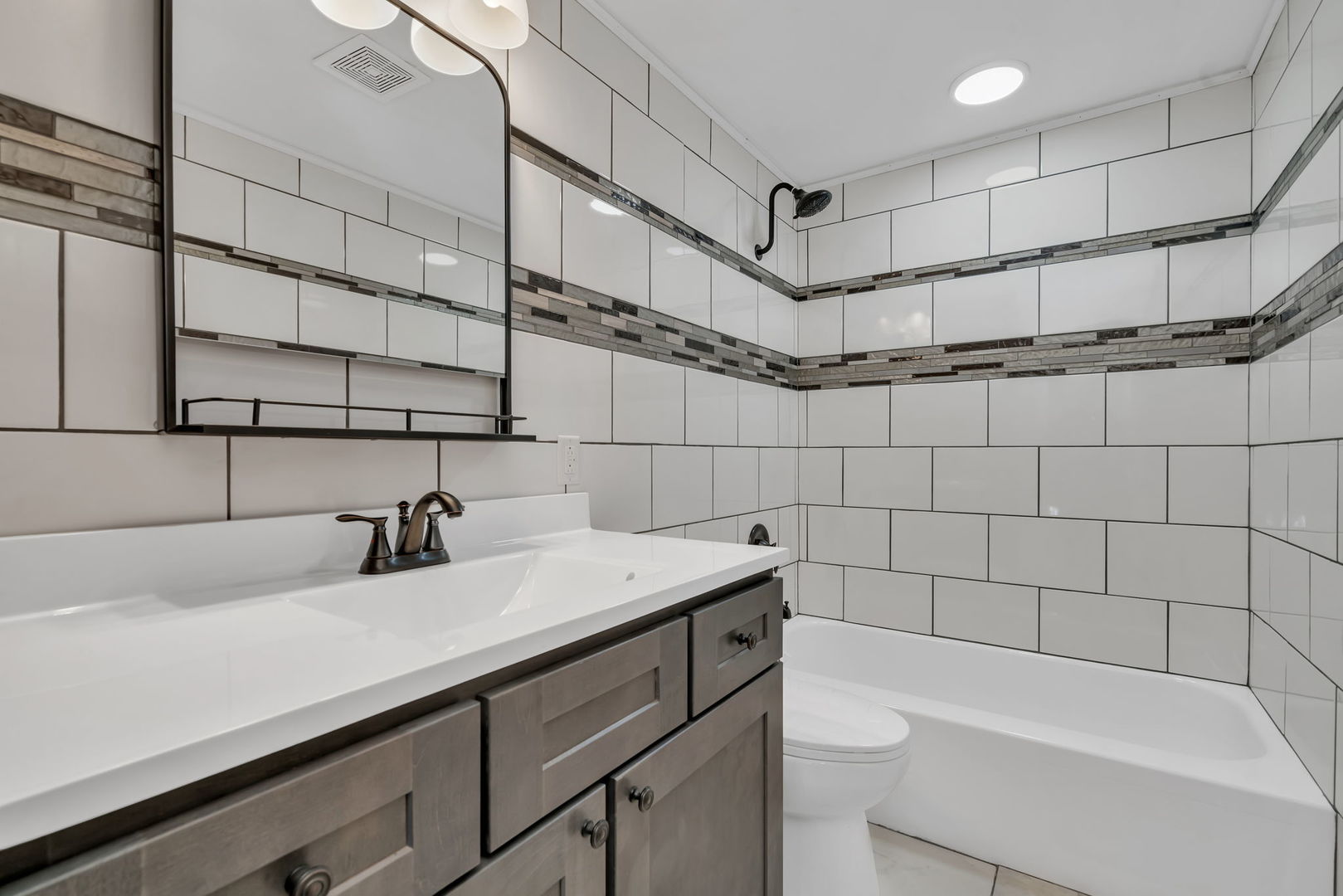 53 Duncan Drive Bourbonnais, IL 60914 - Photo 21 of 49 a bathroom with a sink a toilet and shower