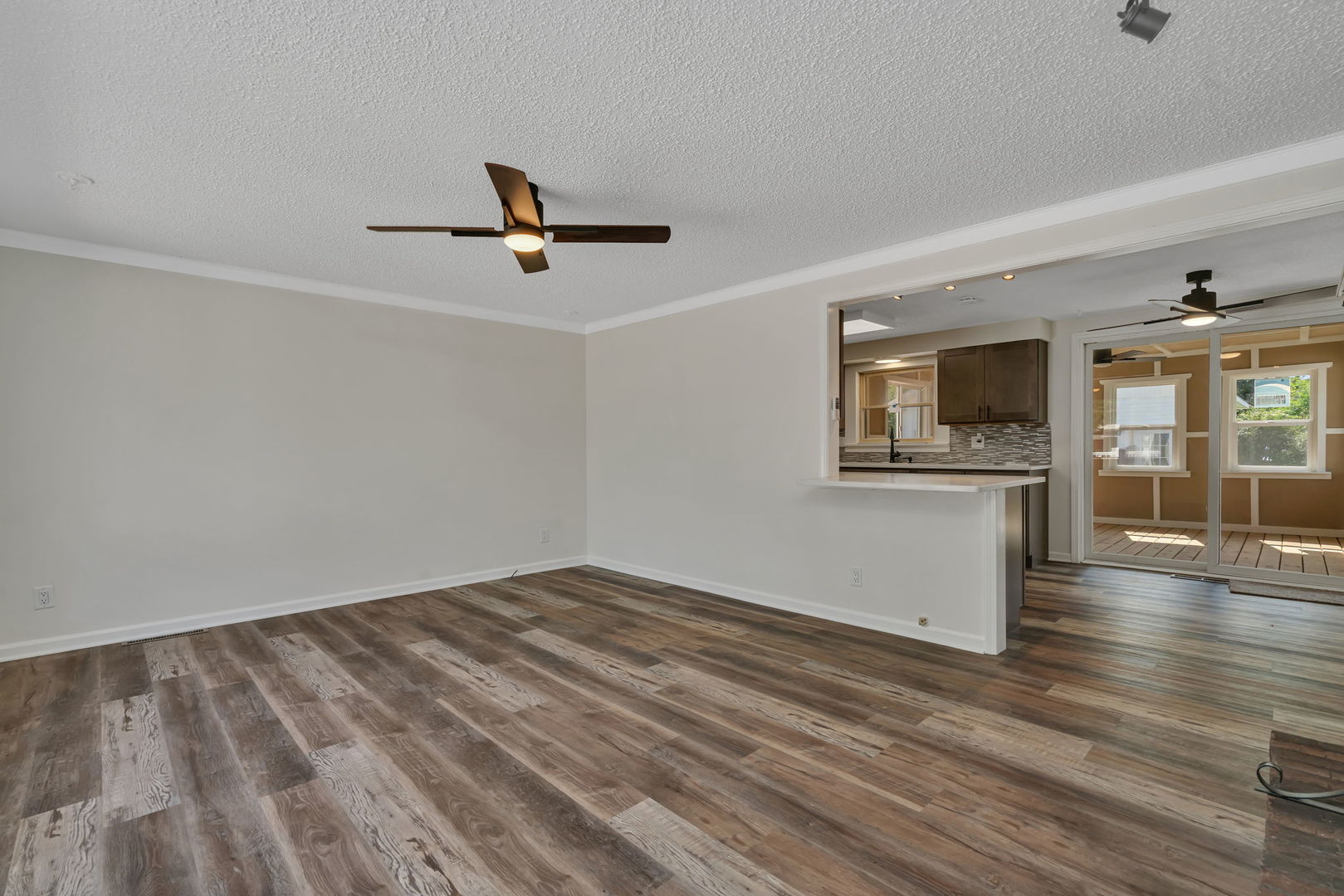 53 Duncan Drive Bourbonnais, IL 60914 - Photo 5 of 49 a view of empty room with wooden floor and fan