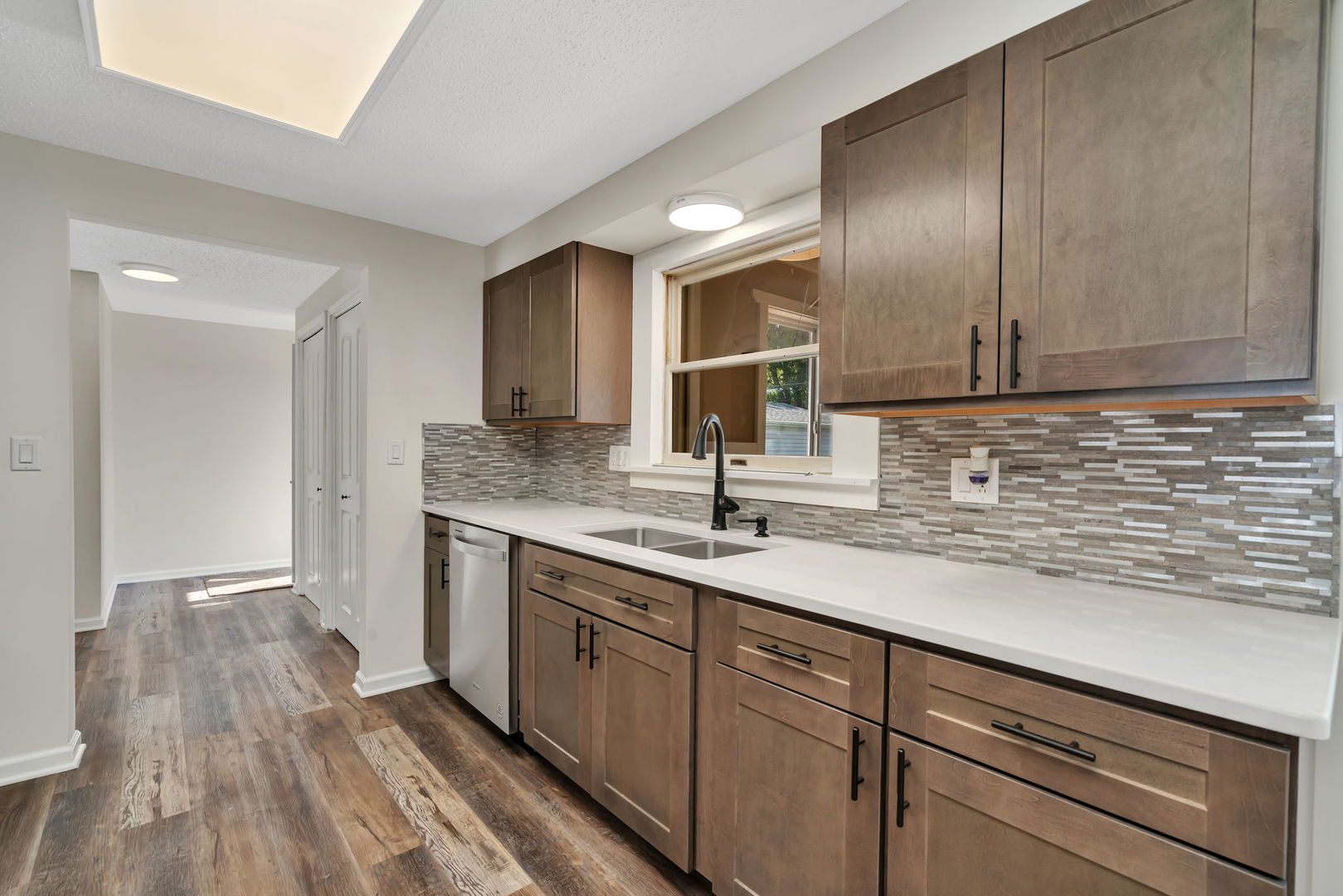 53 Duncan Drive Bourbonnais, IL 60914 - Photo 7 of 49 a kitchen with a sink cabinets and wooden floor