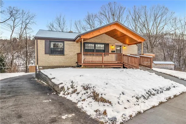 a backyard of a house with wooden fence