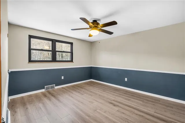 an empty room and window