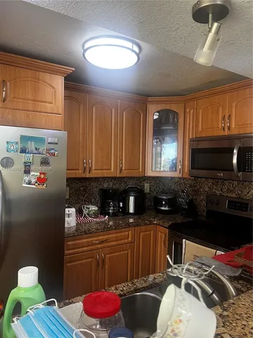 a kitchen with a sink and a stove