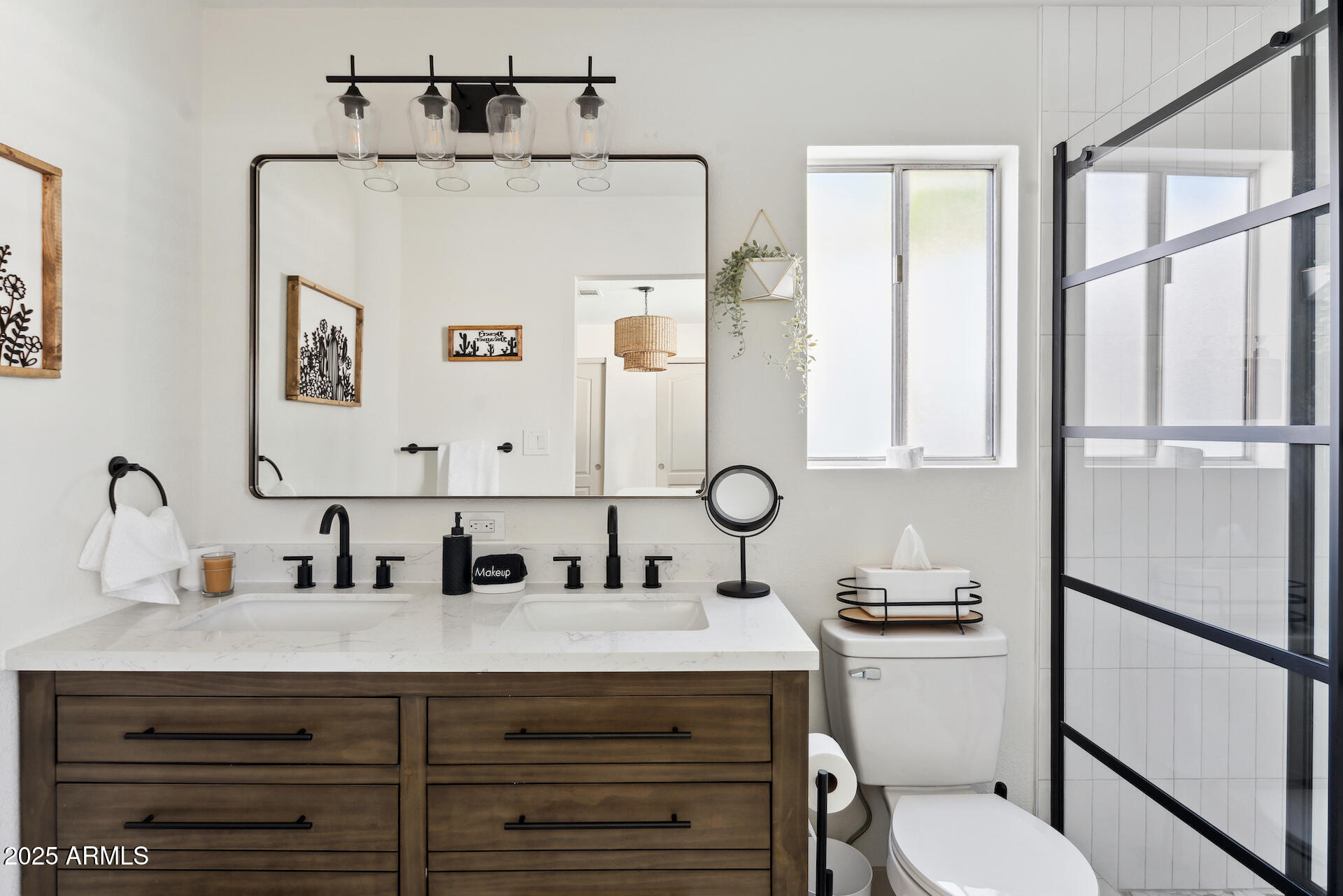15641 North 63rd Street Scottsdale, AZ 85254 - Photo 13 of 32 a bathroom with a sink a toilet and mirror