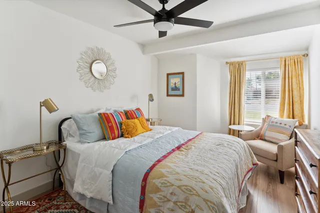 a bedroom with bed and window