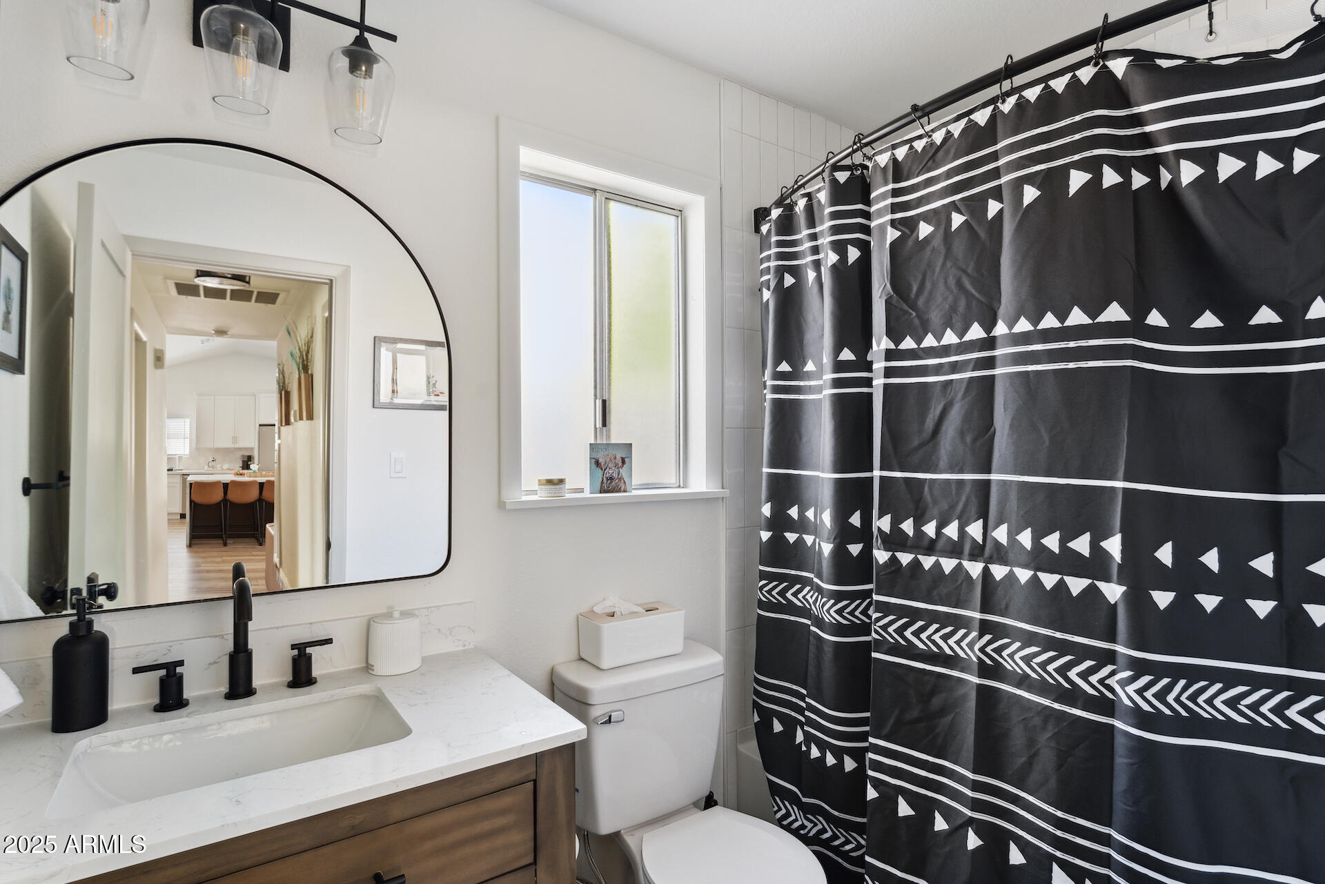 15641 North 63rd Street Scottsdale, AZ 85254 - Photo 16 of 32 a bathroom with a toilet a sink and mirror