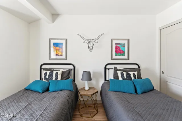 a bedroom with a bed and a couch