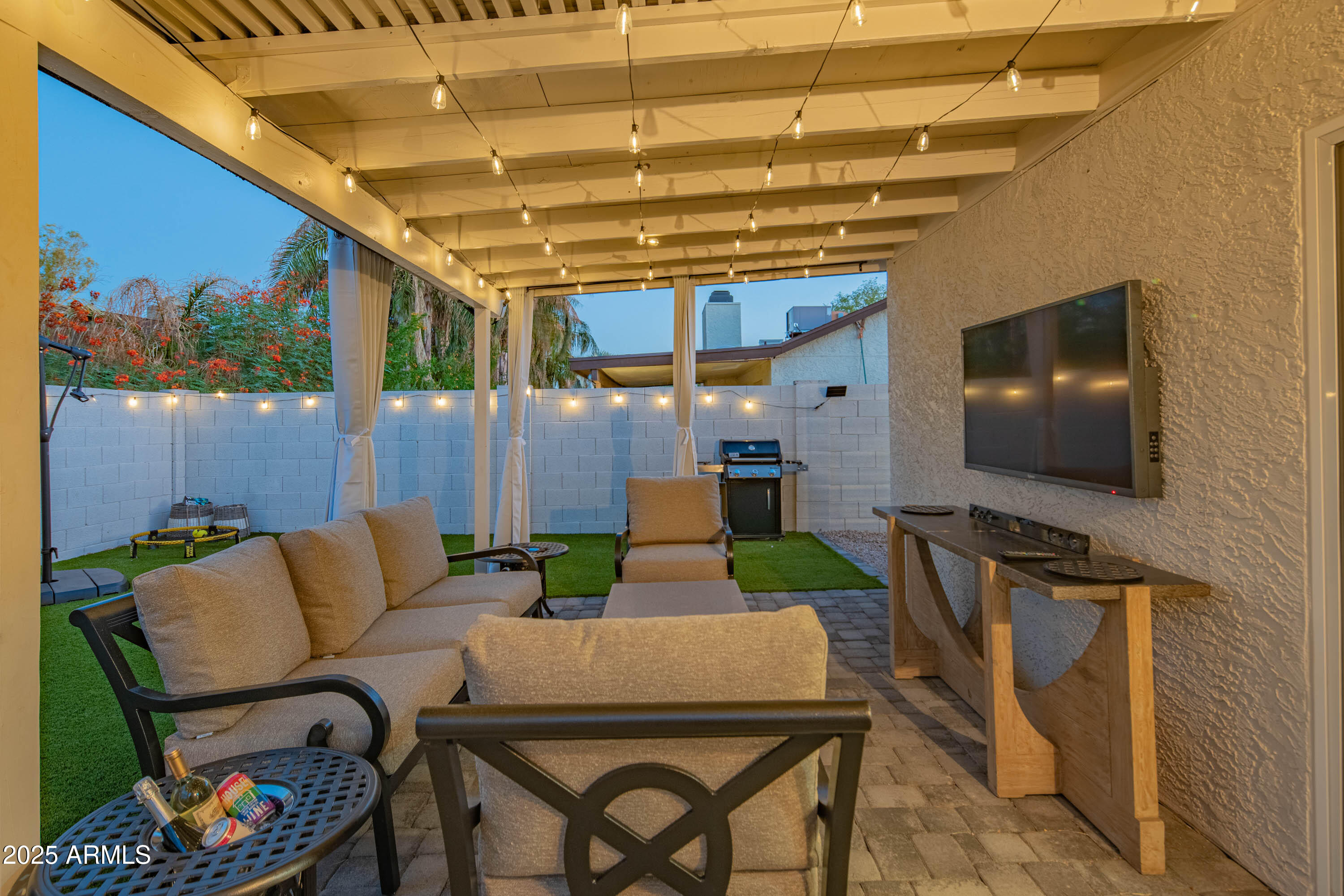 15641 North 63rd Street Scottsdale, AZ 85254 - Photo 18 of 32 a outdoor living space with furniture and a flat screen tv