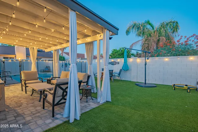a view of a chairs and table in patio