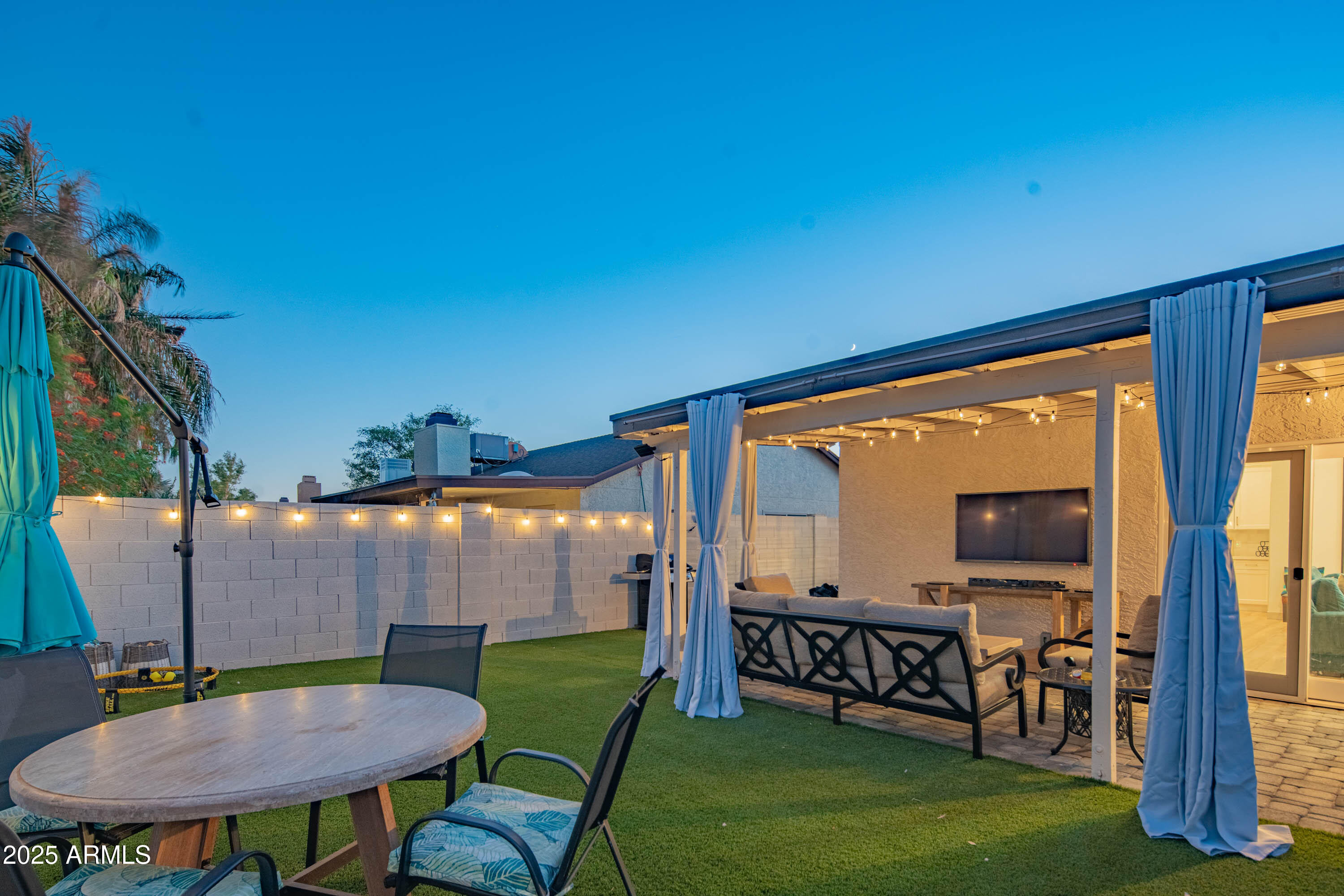 15641 North 63rd Street Scottsdale, AZ 85254 - Photo 23 of 32 a view of a chairs and table in patio with a yard