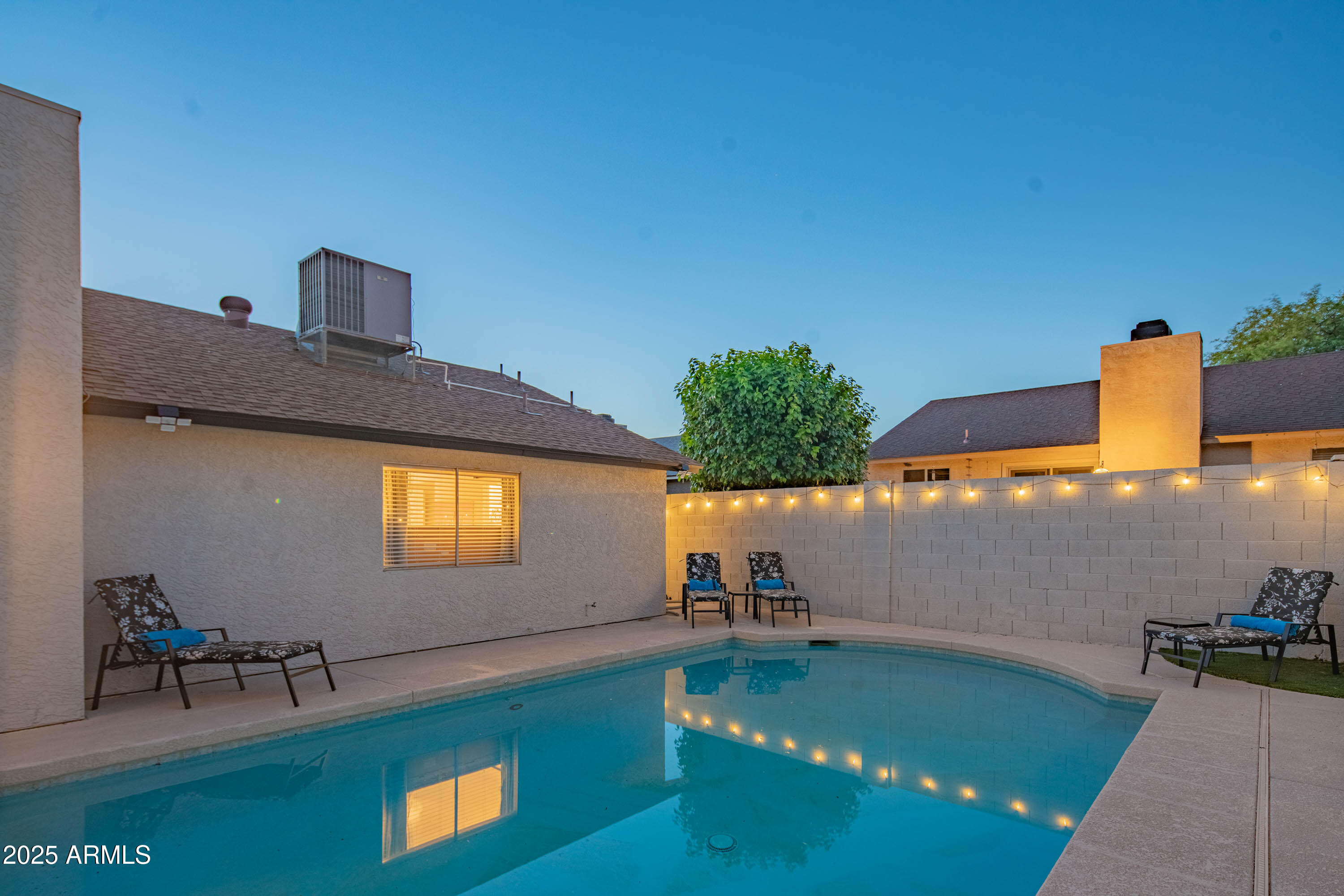 15641 North 63rd Street Scottsdale, AZ 85254 - Photo 26 of 32 a view of a backyard with a swimming pool