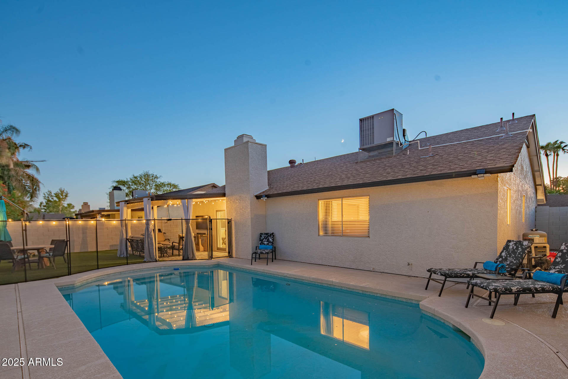 15641 North 63rd Street Scottsdale, AZ 85254 - Photo 27 of 32 a view of a swimming pool with an outdoor seating