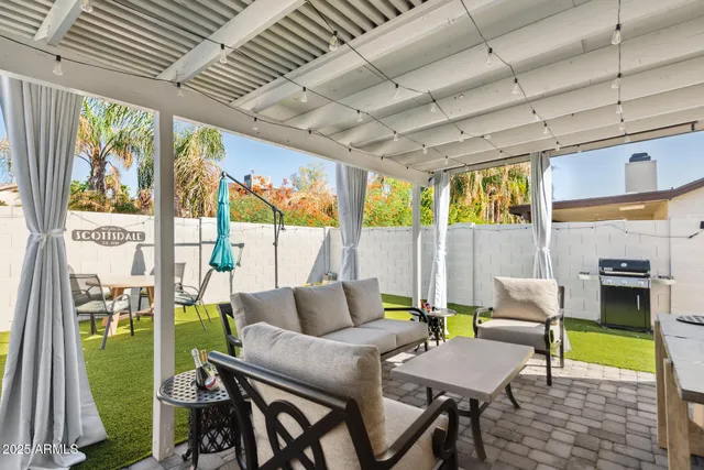 a front view of a house with a yard table and chairs