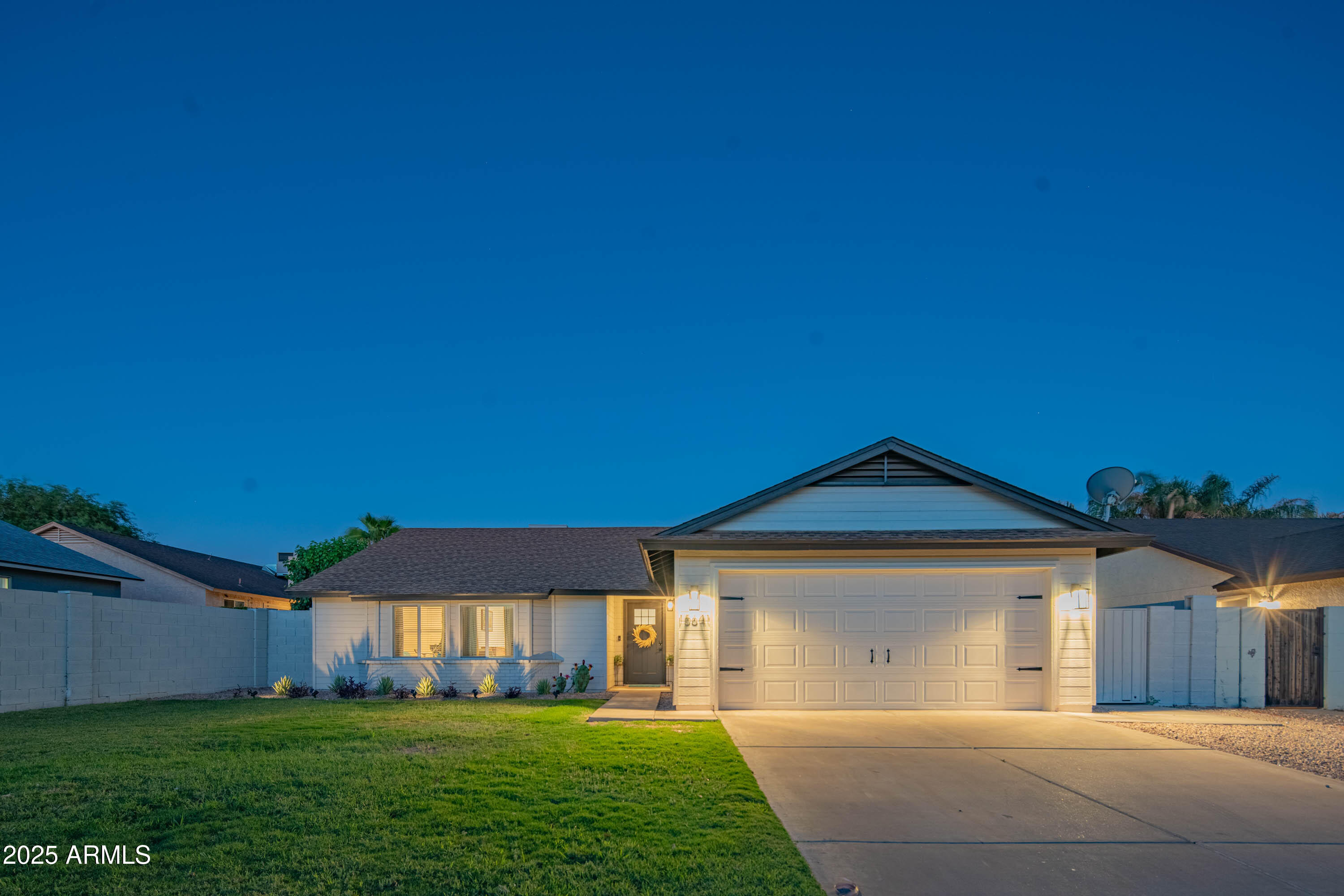 15641 North 63rd Street Scottsdale, AZ 85254 - Photo 3 of 32 a front view of a house with garden